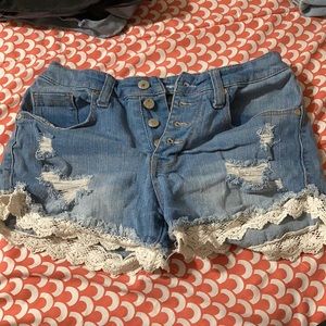 Jean shorts with lace-like fabric.